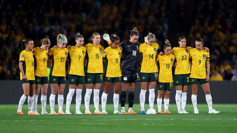 Australia players during a minutes silence for the victims of the shooting in Auckland before the match