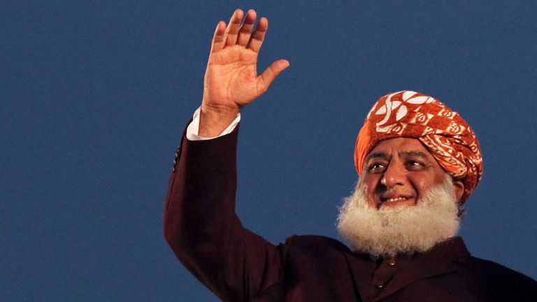 Pakistani politician Maulana Fazlur Rehman and Bilawal Bhutto Zardari, chairman of the Pakistan Peoples Party (PPP), wave to the supporters during an anti-government protest rally organized by the Pakistan Democratic Movement (PDM), an alliance of political opposition parties, in Lahore, Pakistan December 13, 2020. REUTERS/Mohsin Raza