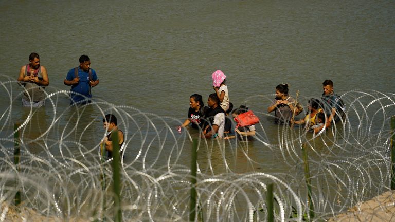 Migrants try to cross the Rio Grande from Mexico. Pic: AP
