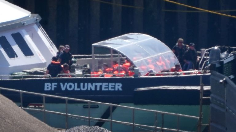 A group of people thought to be migrants are brought to Dover onboard a Border Force vessel on Friday