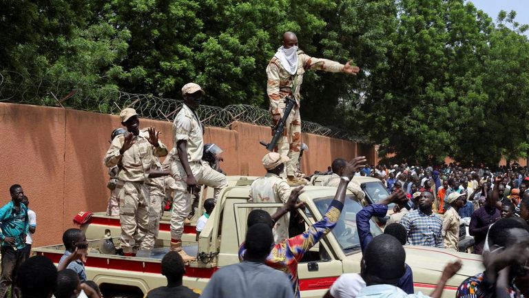 Nigerien security forces prepare to disperse pro-junta demonstrators gathered outside the French embassy, in Niamey, the capital city of Niger 30 July, 2023