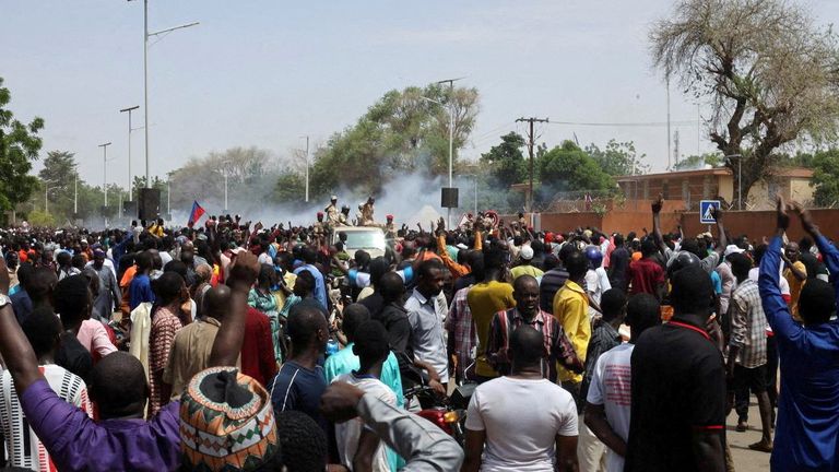 Nigerien security forces launch tear gas to disperse pro-junta demonstrators gathered outside the French embassy, in Niamey, the capital city of Niger July 30, 2023. REUTERS/Souleymane Ag Anara REFILE – CORRECTING NATIONALITY NO RESALES. NO ARCHIVES