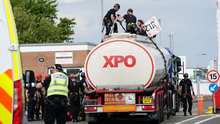 Police prepare to remove protesters from This Is Rigged as they sit on top of an oil tanker at the Ineos refinery in Grangemouth, Fife in Scotland. Picture date: Wednesday July 19, 2023.