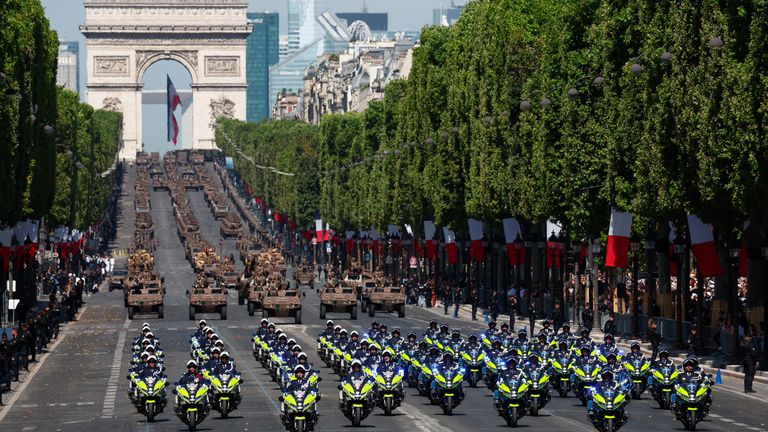 French CNFSR unit members drive down the Champs-Elysees Avenue during the annual Bastille Day military parade in Paris, France, July 14, 2023. REUTERS/Gonzalo Fuentes
