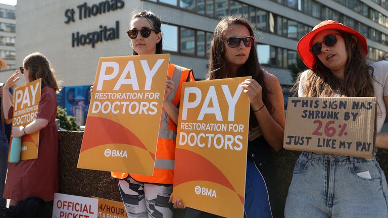 Demonstrators protest at a picket line outside of St Thomas&#39; Hospital as junior doctors strike over pay and conditions, in London, Britain, June 14, 2023. REUTERS/Toby Melville
