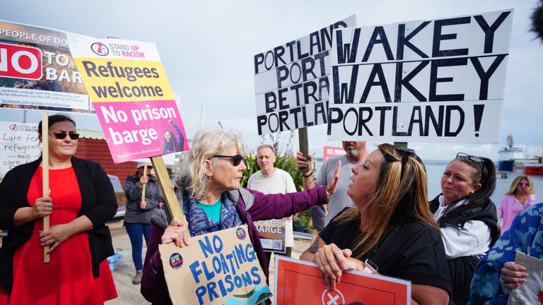 Rival protesters argue in Portland in Dorset after the Bibby Stockholm accommodation barge arrived from dry dock in Falmouth, Cornwall, where it is due to house migrants. Picture date: Tuesday July 18, 2023. PA Photo. See PA story POLITICS Migrants. Photo credit should read: Ben Birchall/PA Wire 