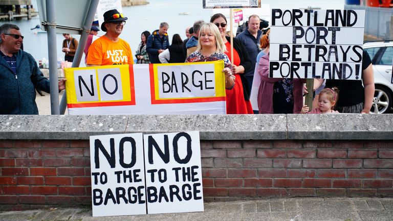 Protesters in Portland in Dorset after the Bibby Stockholm accommodation barge arrived from dry dock in Falmouth, Cornwall, where it is due to house migrants. Picture date: Tuesday July 18, 2023. PA Photo. See PA story POLITICS Migrants. Photo credit should read: Ben Birchall/PA Wire 