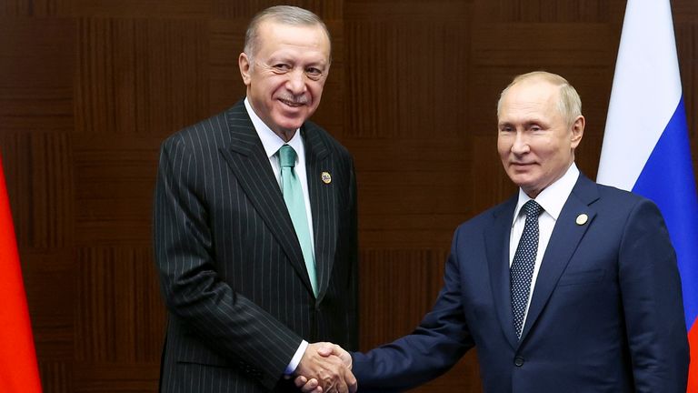Russia&#39;s President Vladimir Putin, right, and Turkey&#39;s President Recep Tayyip Erdogan shake hands during their meeting on sidelines of the Conference on Interaction and Confidence Building Measures in Asia (CICA) summit, in Astana, Kazakhstan, Thursday, Oct. 13, 2022. (Vyacheslav Prokofyev, Sputnik, Kremlin Pool Photo via AP)
