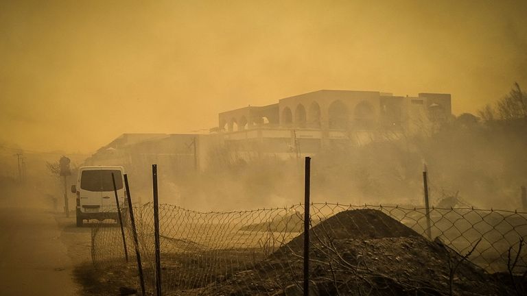 A burnt hotel during a wildfire on the island of Rhodes