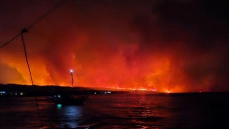 Flames lit up the sky as the family desperately tried to flee the holiday island 