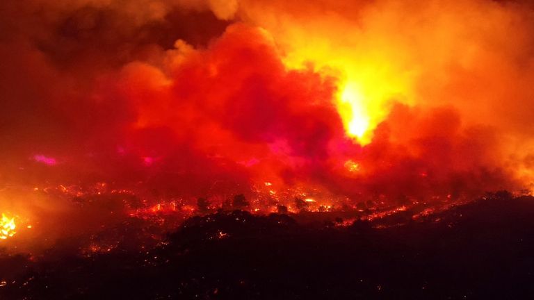 Smoke rises from a wildfire on the island of Rhodes. Pic: Ted G Bailos via Reuters