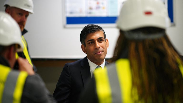 British Prime Minister Rishi Sunak speaks with apprentices and graduates, during a visit to Crofton Park, near Rednal, Birmingham, Britain. Picture date: Monday July 24, 2023. Ben Birchall/Pool via REUTERS