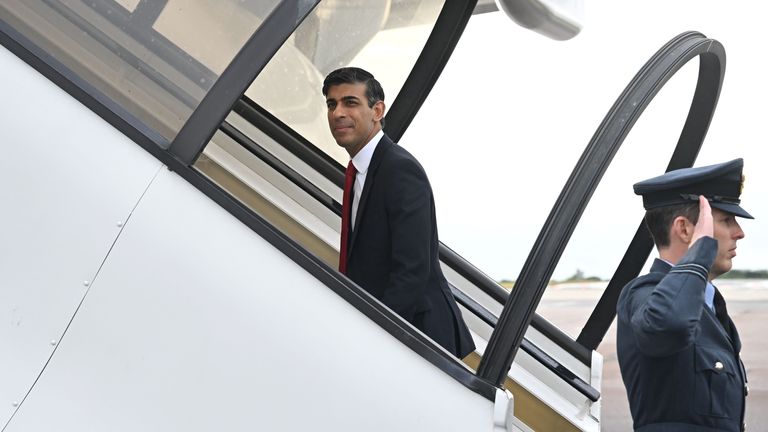 Prime Minister Rishi Sunak walks across the tarmac to board his plane at London Stansted airport, in Essex, departing to Vilnius, Lithuania, where he is to attend a NATO Summit. Picture date: Tuesday July 11, 2023.