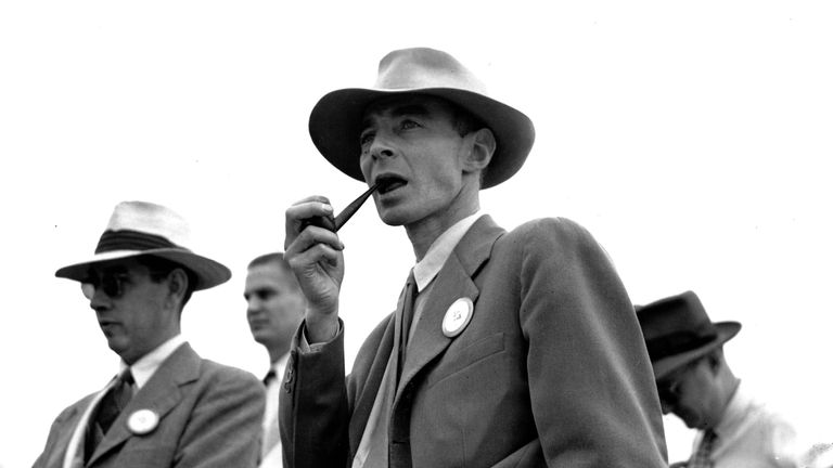 At the atomic bomb testing site near Almagordo, New Mexico, Dr. J. Robert Oppenheimer, a physicist at the University of California, gazed at the site while smoking a pipe.  October 9, 1945.  (Photo by Associated Press)