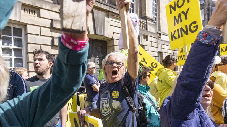 Protesters on The Royal Mile in Edinburgh, ahead of the National Service of Thanksgiving and Dedication for King Charles III and Queen Camilla, and the presentation of the Honours of Scotland at St Giles&#39; Cathedral. Picture date: Wednesday July 5, 2023.