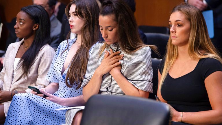 FILE - United States gymnasts from left, Simone Biles, McKayla Maroney, Aly Raisman and Maggie Nichols, arrive to testify during a Senate Judiciary hearing about the Inspector General&#39;s report on the FBI&#39;s handling of the Larry Nassar investigation on Capitol Hill, Wednesday, Sept. 15, 2021, in Washington. Olympic gold medalist Simone Biles and dozens of other women who say they were sexually assaulted by Larry Nassar are seeking more than $1 billion from the FBI for failing to stop the now convicted sports doctor when the agency first received allegations against him, lawyers said Wednesday, June 8, 2022. (Saul Loeb/Pool via AP, File)