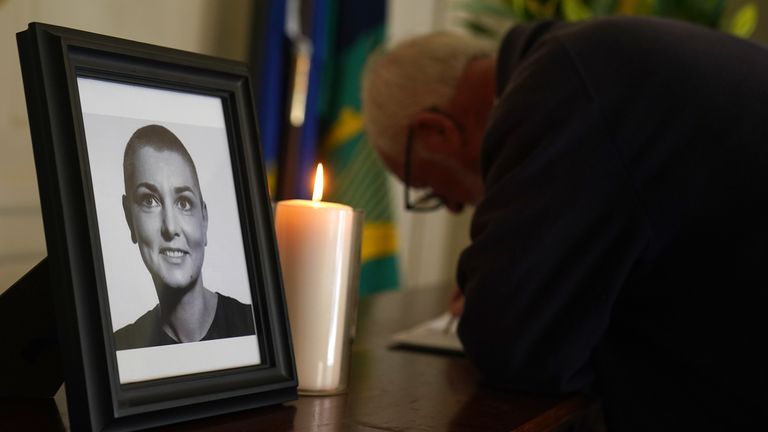A person signs a book of condolence for Sinead O&#39;Connor at the Mansion House in Dublin, after her death at the age of 56. The Irish singer was found "unresponsive" at a home in Lambeth, south London on Wednesday. Picture date: Friday July 28, 2023.