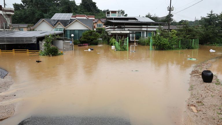 Rising flood waters invaded homes in Cheongju, South Korea Pic: AP
