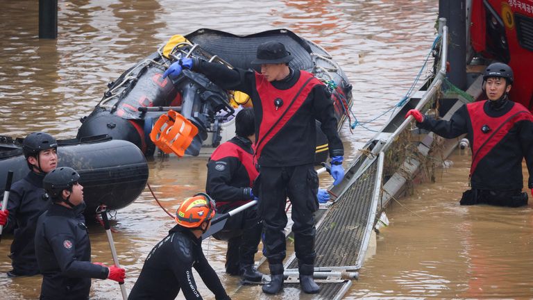 Search and rescue operation at an underpass that has been submerged by a flooded river caused by torrential rain in Cheongju

