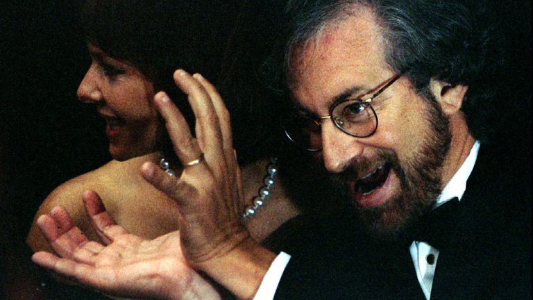 Spielberg makes a dinosaur gesture at the premier of Jurassic Park in 1993 