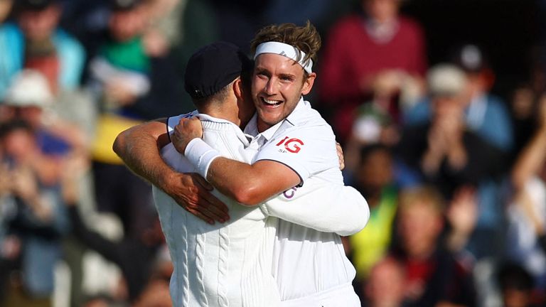  England's Stuart Broad celebrates with James Anderson after taking the wicket of Australia's Alex Carey 
