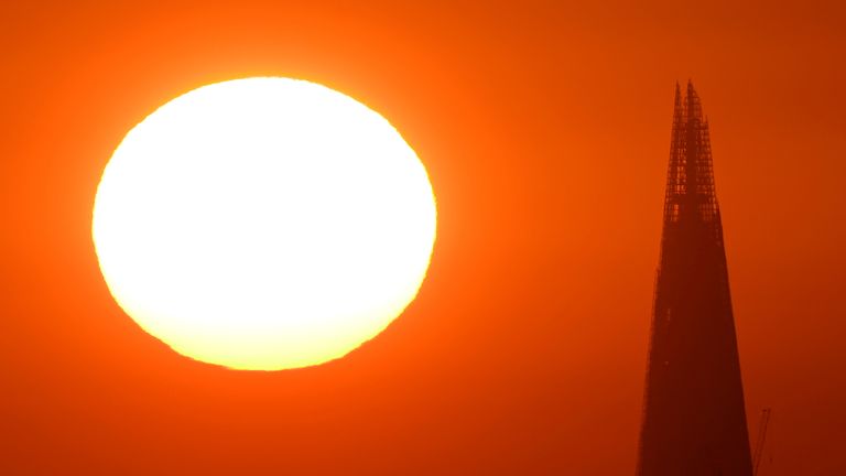 The sun rises behind The Shard skyscraper, as a second heatwave is predicted for parts of the country, in London, Britain, August 11, 2022. REUTERS/Toby Melville