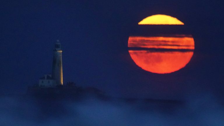 The Full Buck supermoon rises over St Mary's Lighthouse in Whitley Bay