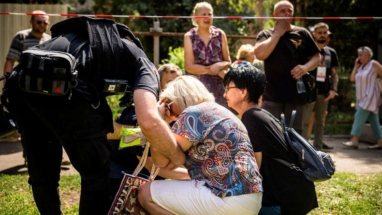 Local residents react at a site of an apartment building heavily damaged by a Russian missile strike, amid Russia&#39;s attack on Ukraine, in Kryvyi Rih, Ukraine July 31, 2023. Press service of the State Emergency Service of Ukraine/Handout via REUTERS ATTENTION EDITORS - THIS IMAGE HAS BEEN SUPPLIED BY A THIRD PARTY.
