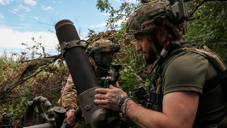 An assault brigade of the Armed Forces of Ukraine, prepare to fire a mortar