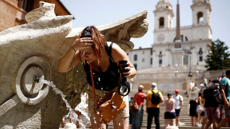 A woman cools off at Fontana della Barcaccia at the Spanish Steps during a heat wave across Italy as temperatures are expected to rise further in the coming days, in Rome, Italy July 17, 2023. REUTERS/Guglielmo Mangiapane TPX IMAGES OF THE DAY