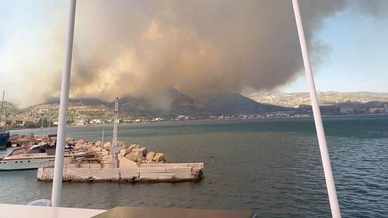 Fire and smoke spread on the hills at the Corinth Canal, Greece, July 17, 2023 in this still image from video obtained from social media. Iymane Rhimi/via REUTERS THIS IMAGE HAS BEEN SUPPLIED BY A THIRD PARTY. MANDATORY CREDIT. NO RESALES. NO ARCHIVES.
