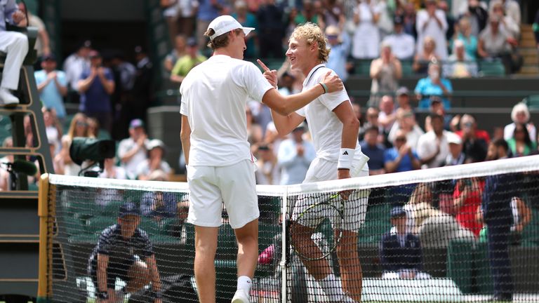 Henry Searle (L) celebrates with the trophy after victory against Yaroslav 