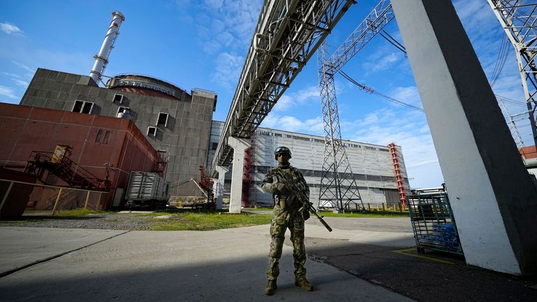FILE - A Russian serviceman guards in an area of the Zaporizhzhia Nuclear Power Station in territory under Russian military control, southeastern Ukraine, May 1, 2022. The head of the U.N. nuclear watchdog says Ukraine...s Zaporizhzhia Nuclear Power Plant has switched to emergency diesel generators after losing ..its external power supply for the seventh time since Russia...s full-scale invasion. (AP Photo/File)