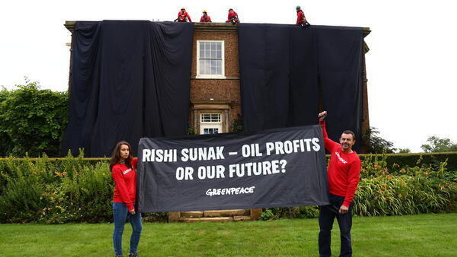 Greenpeace activists drape Rishi Sunak's £2m mansion in oil-black fabric after climbing on roof