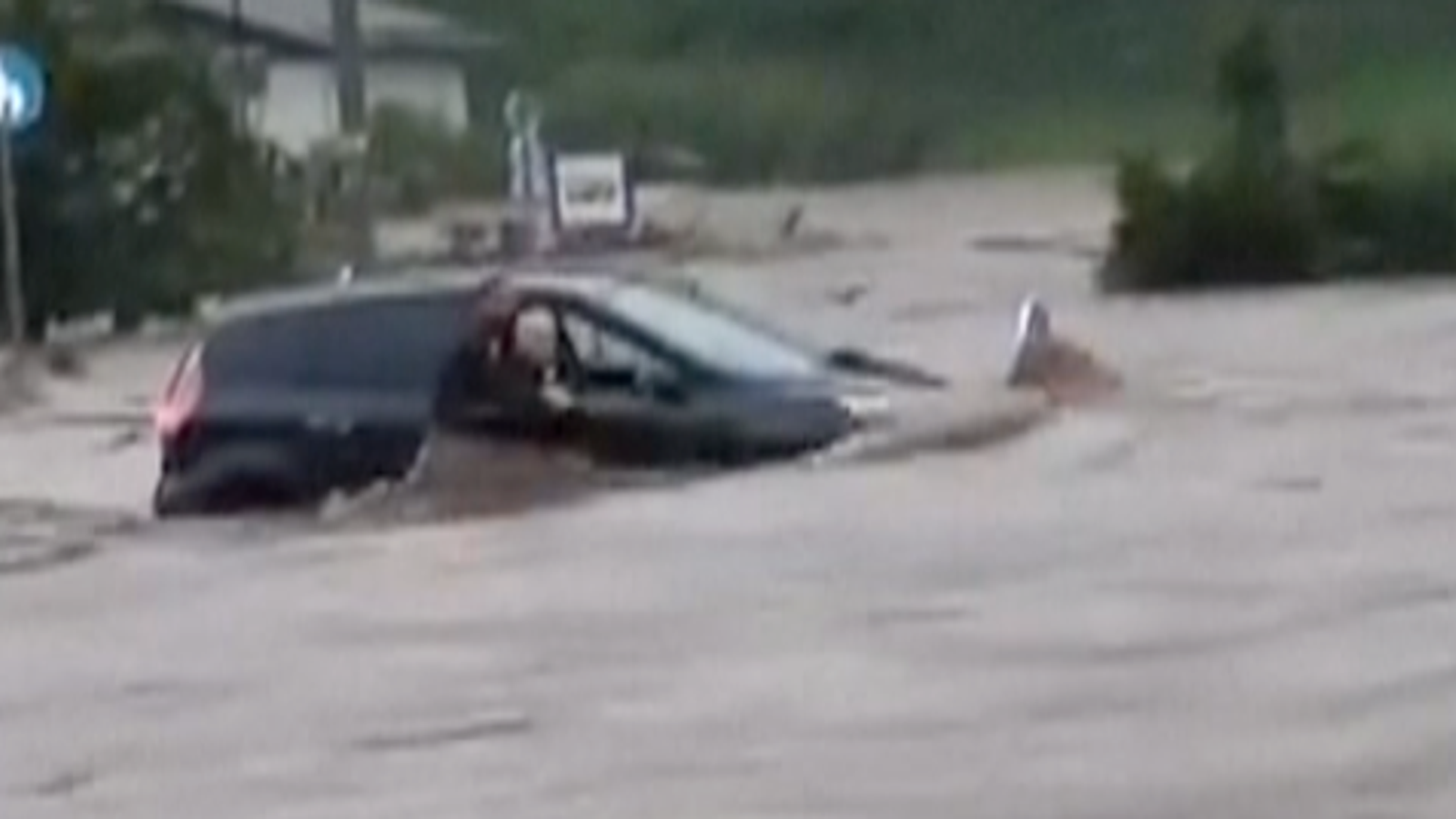 Slovenia Woman rescued from submerged car as heavy rains cause flash