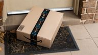 Amazon Prime box delivered to a front door of residential building