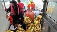 Rescued migrants on a French rescue ship. Pic: Anne Thorel/SNSM handout via Reuters 