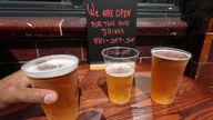 Takeaway pints of beer outside Charrington&#39;s Noted Ales And Stout pub in London, as further coronavirus lockdown restrictions are lifted in England. PA Photo. Picture date: Friday June 26, 2020. See PA story HEALTH Coronavirus. Photo credit should read: Yui Mok/PA Wire..