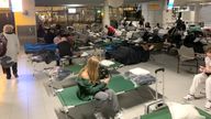 Stranded passengers at Schiphol Airport in Amsterdam on Tuesday