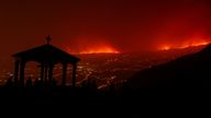 A view shows a fire over the mountains near empty houses after the evacuation in different villages in the north, as wildfires rage out of control on the island of Tenerife, Canary Islands, Spain August 20, 2023. REUTERS/Nacho Doce TPX IMAGES OF THE DAY REFILE - QUALITY REPEAT DUE TO TECHNICAL ISSUE