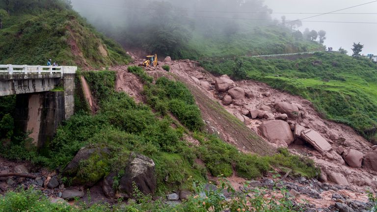 The aftermath of a landslide which damaged part of a road near Dharamshala, India. Pic: AP