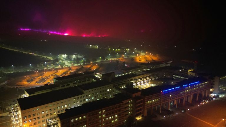 Fire burns on a hill near a hospital in Alexandroupolis, in the northeastern Evros region, Greece 
Pic:AP