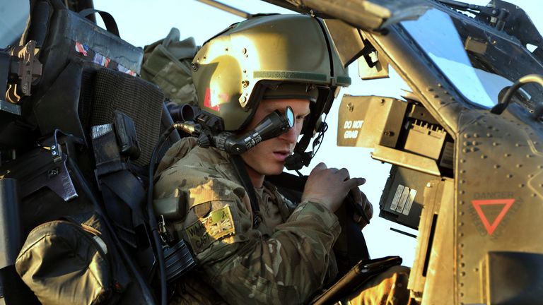 Britain&#39;s Prince Harry wears his monocle gun sight as he sits in his Apache helicopter in Camp Bastion, southern Afghanistan in this photograph taken November 2, 2012, and released January 21, 2013. The Prince, who is serving as a pilot/gunner with 662 Squadron Army Air Corps, is on a posting to Afghanistan that runs from September 2012 to January 2013. Photograph taken November 2, 2012. REUTERS/John Stillwell/Pool (AFGHANISTAN - Tags: MILITARY POLITICS SOCIETY ROYALS CONFLICT)
