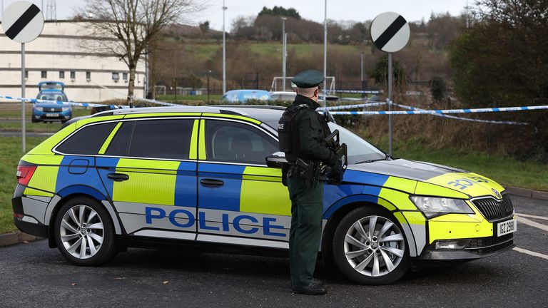 An armed officer of the Police Service of Northern Ireland (PSNI) on duty near the sports complex in the Killyclogher Road area of Omagh, Co Tyrone, where off-duty PSNI Detective Chief Inspector John Caldwell was shot a number of times by masked men in front of young people he had been coaching. Mr Caldwell remains in a critical but stable condition in hospital following the attack on Wednesday evening. Picture date: Thursday February 23, 2023.