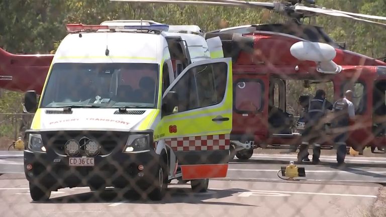 This image made from video shows a helicopter and ambulance involved in rescue mission, following an aircraft crash, in Darwin, Australia, Sunday, Aug. 27, 2023. Three United States military personnel were taken to a hospital, one with critical injuries, after a U.S. aircraft crashed on a north Australian island Sunday during a multination military exercise, officials said. (AuBC via AP)