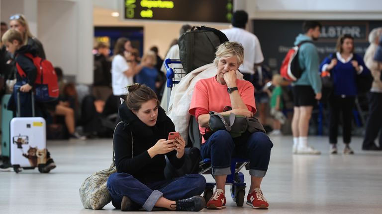 Passengers at Belfast International Airport, as flights to the UK and Ireland have been cancelled as a result of air traffic control issues in the UK. Picture date: Monday August 28, 2023.