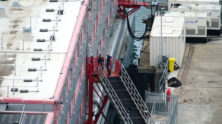 People boarding the Bibby Stockholm accommodation barge at Portland Port in Dorset, which will house up to 500 Asylum seekers. Picture date: Tuesday August 8, 2023.


