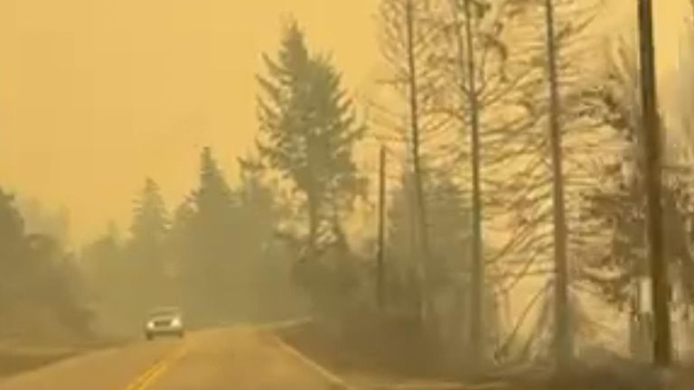 Smoke filled roads in British Columbia as nearly 400 wildfires continued to rage in the Canadian province. 