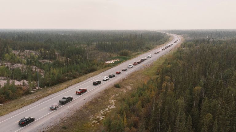 Yellowknife residents leave the city on Highway 3, the only highway in or out of the community, after an evacuation order was given due to the proximity of a wildfire in Yellowknife, Northwest Territories, Canada August 16, 2023. REUTERS/Pat Kane TPX IMAGES OF THE DAY