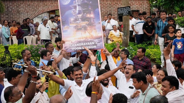 People celebrate as they watch a live telecast of the landing of Chandrayaan-3 in Mumbai
Pic:AP
